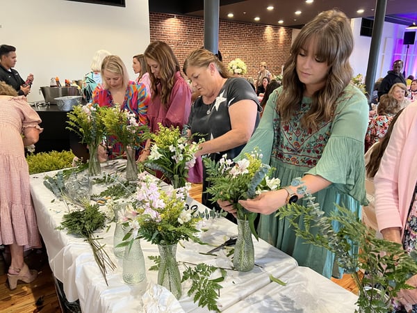 women arranging flowers