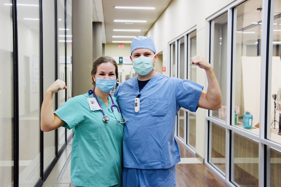 2 SGMC Employees flexing their muscles